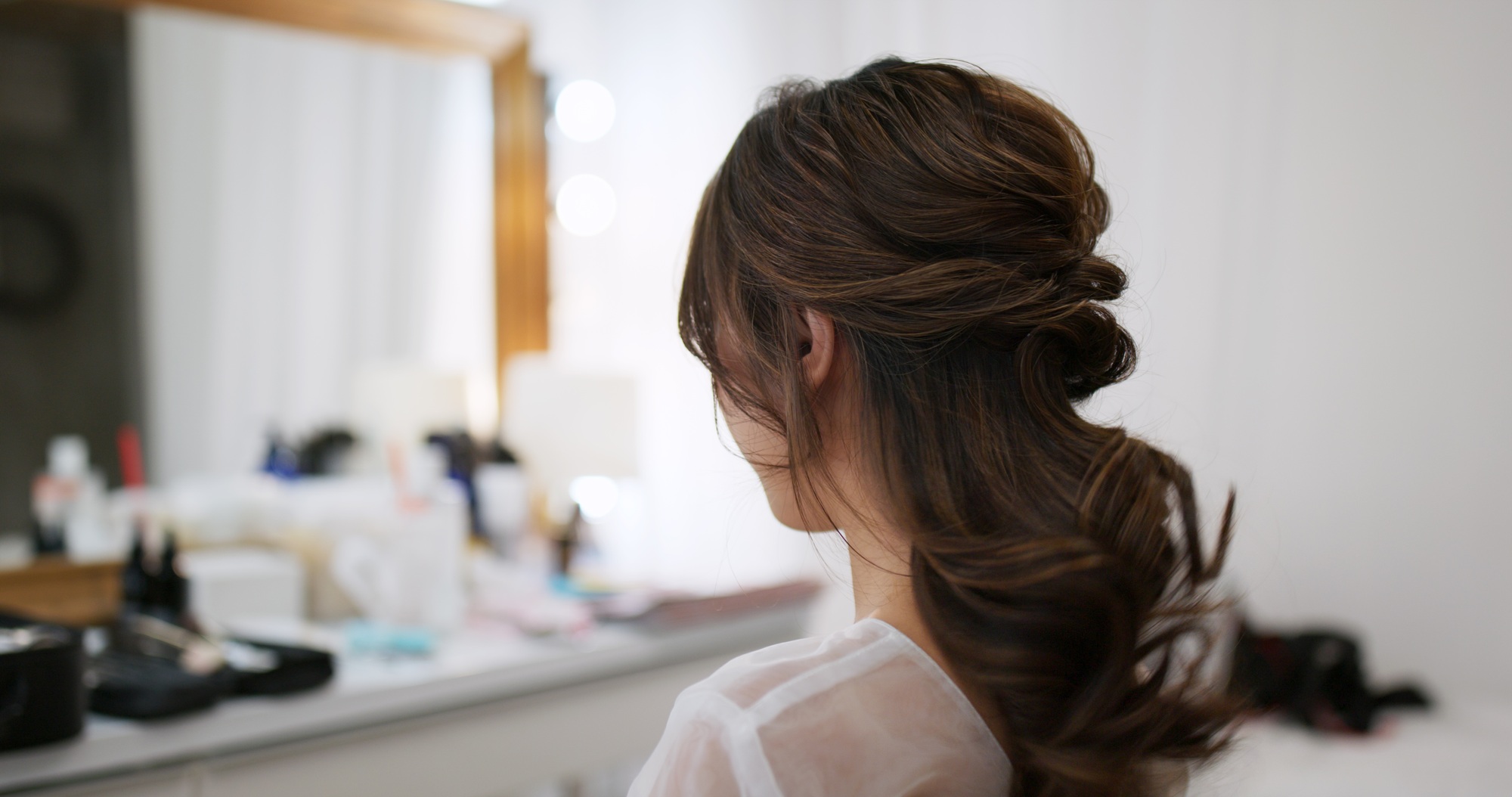 Woman having hair style in beauty salon